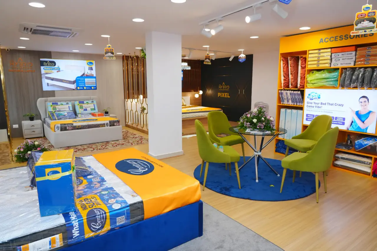 Inside our Vizag showroom: Centuary beds and mattresses on display, a seating corner and the pillows and protectors wall
